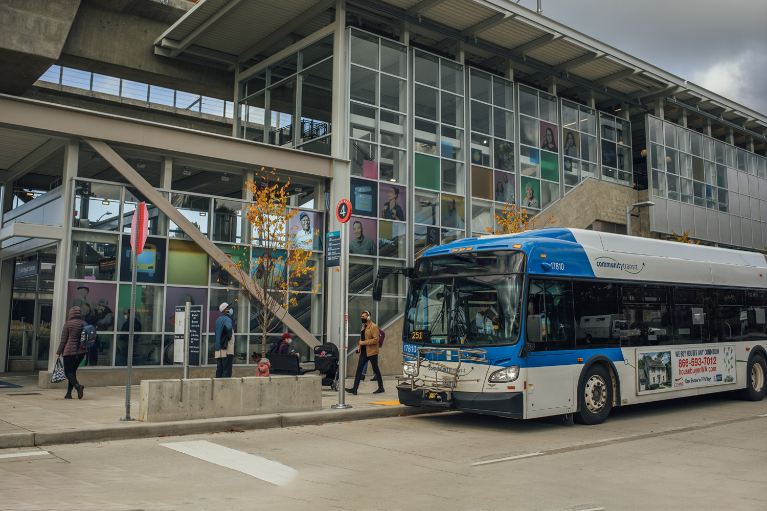 A Community Transit bus is parked outside the Link Northgate Station.