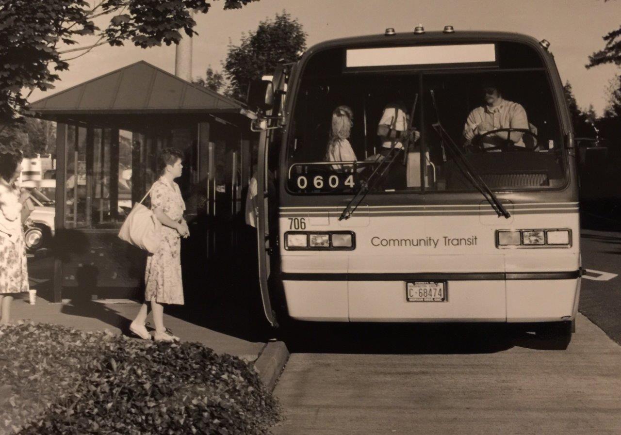 A Community Transit bus picks up riders in 1976
