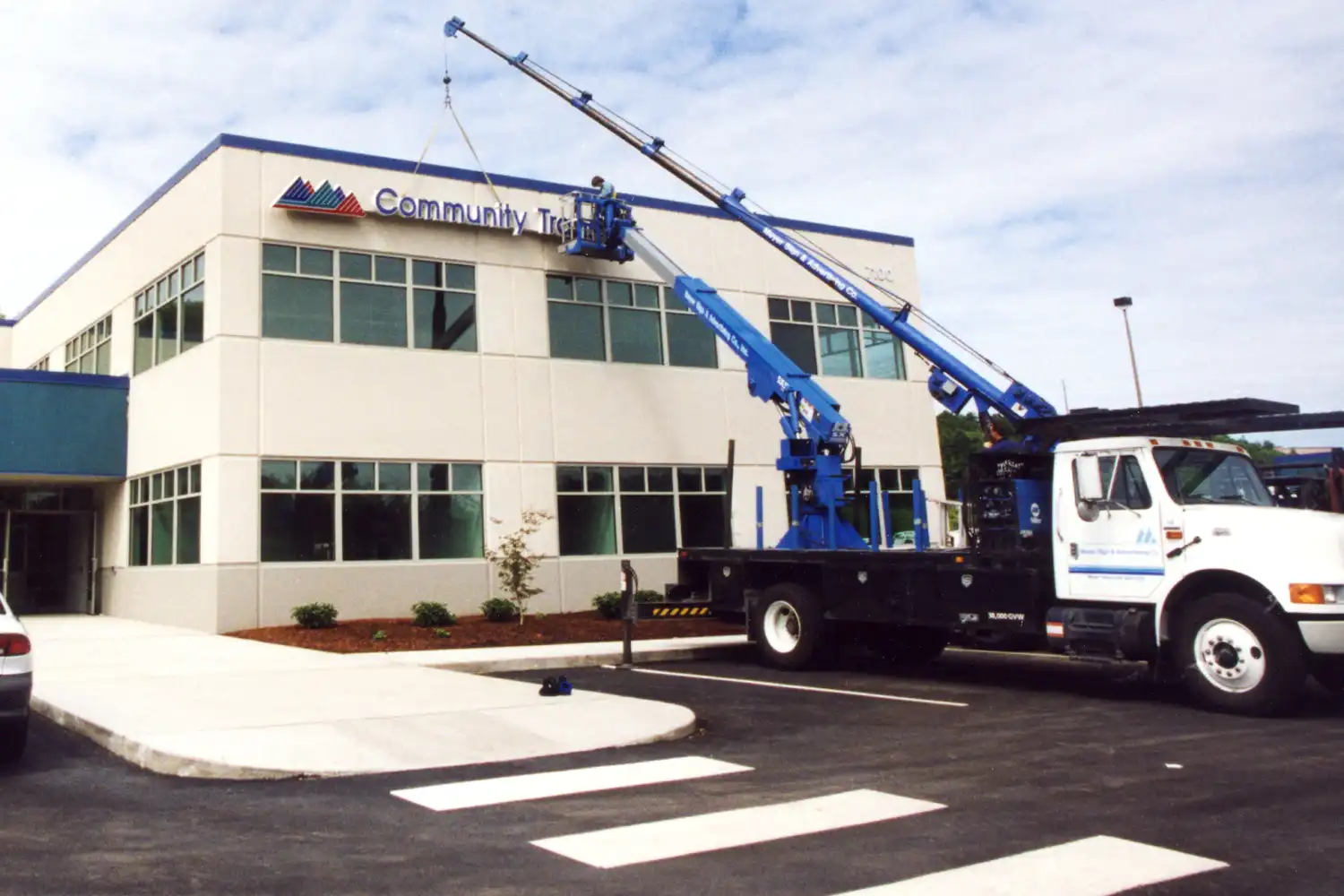 HistoryLink story the CT Merrill Creek HQ building sign being installed in the 90s