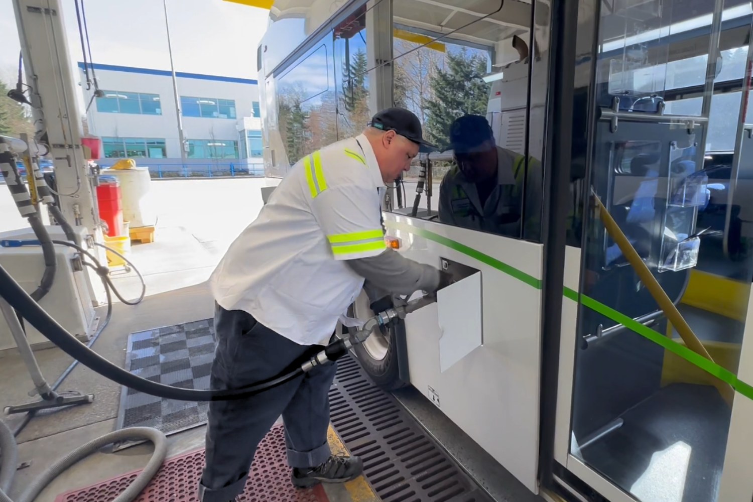 A man fueling a Community Transit bus. 