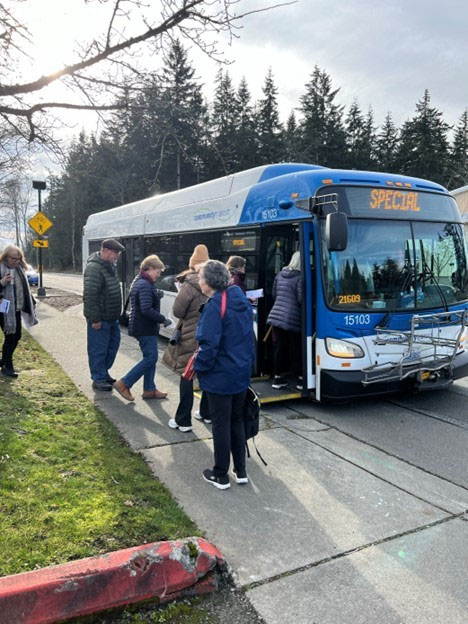 a group of riders learning to the ride the bus practice boarding