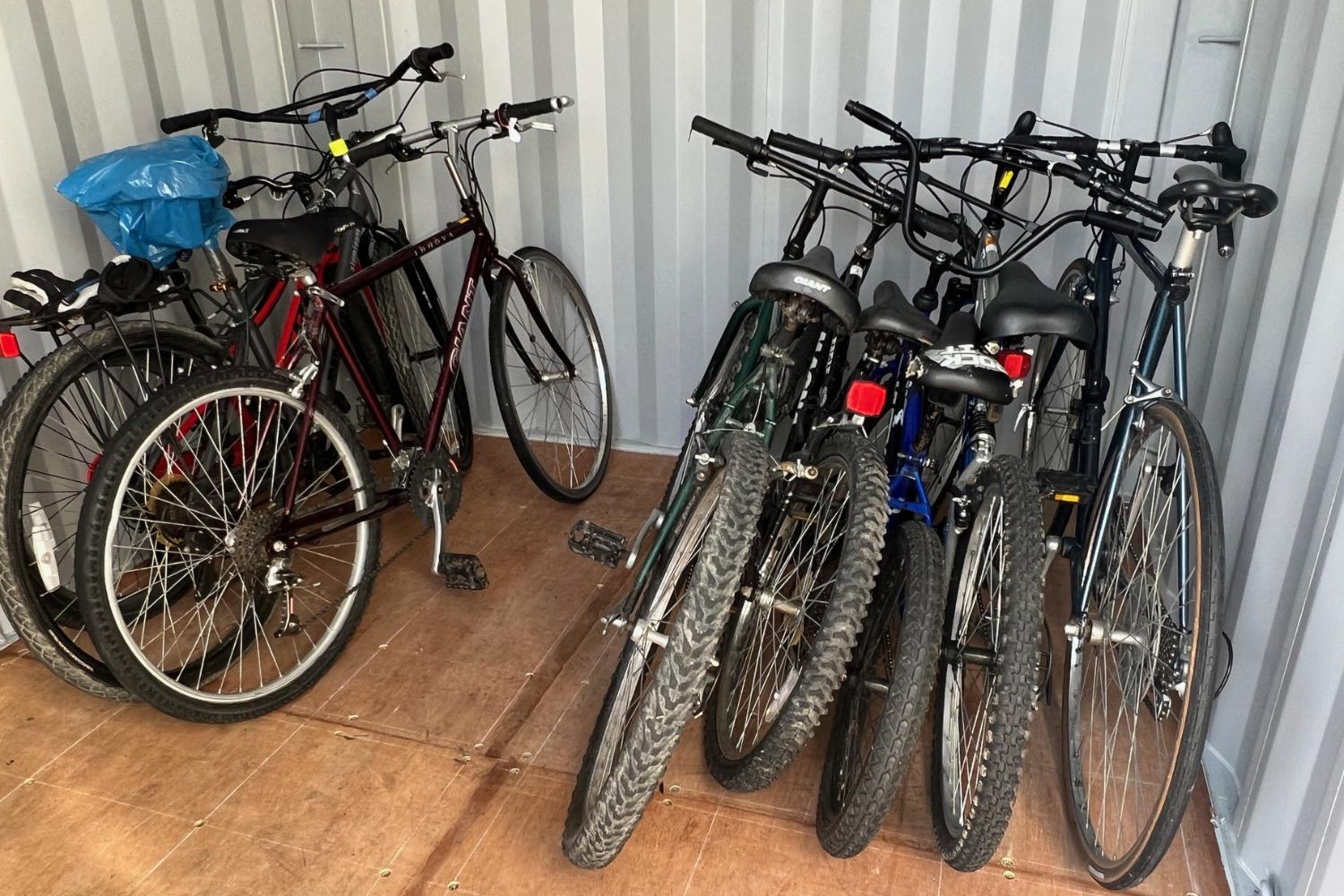 A collection of bikes that are in the RideStore Lost and Found.