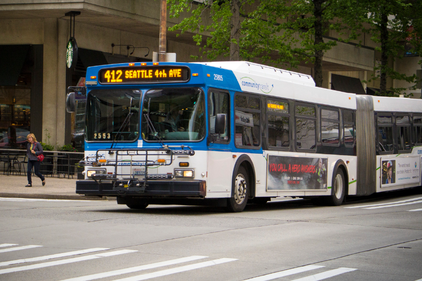 A Community Transit bus serves Route 412 in downtown Seattle