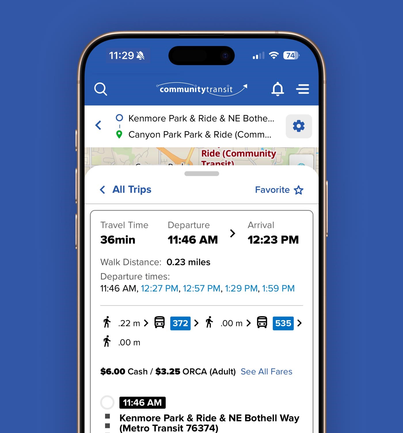 A picture of a phone with the Plan My Trip tool open. A route from Kenmore Park & Ride to Canyon Park Park & Ride is open.