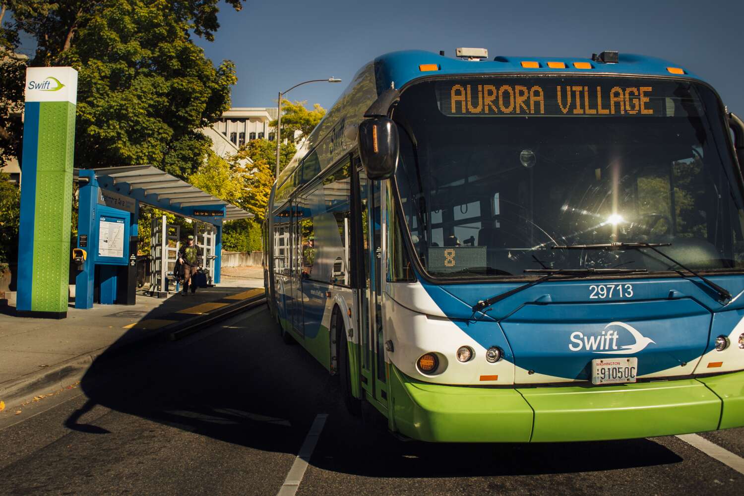 Community Transit bus pulls away from a Swift stop