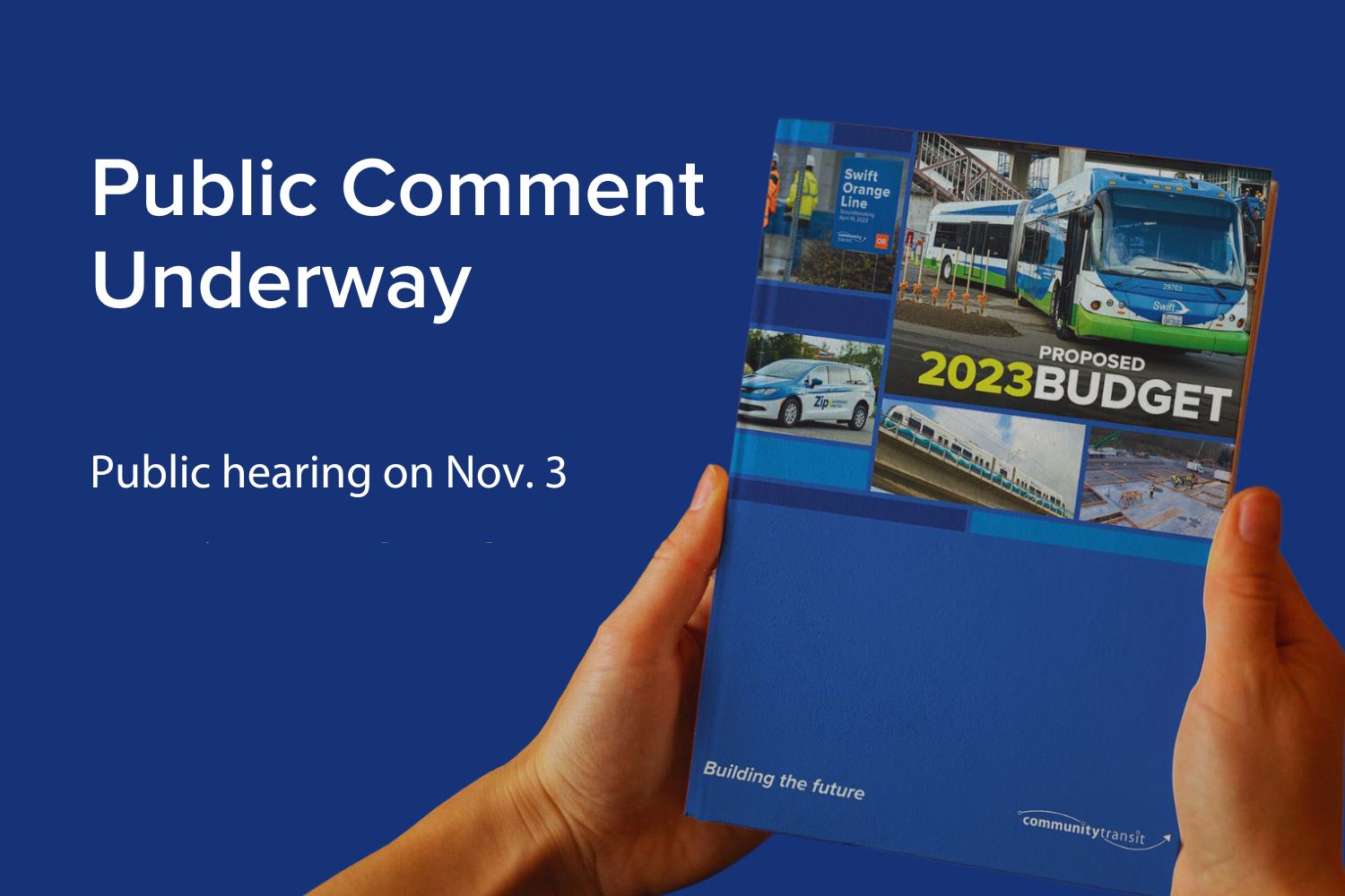 Hands hold a copy of the Proposed 2023 Budget document, open to public comment through Nov. 3