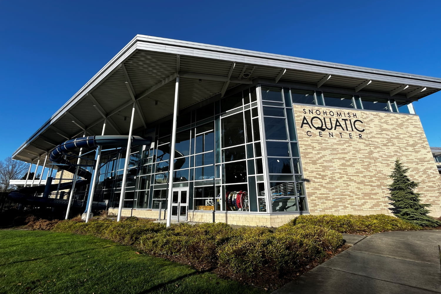 A building with a waterslide coming out of it