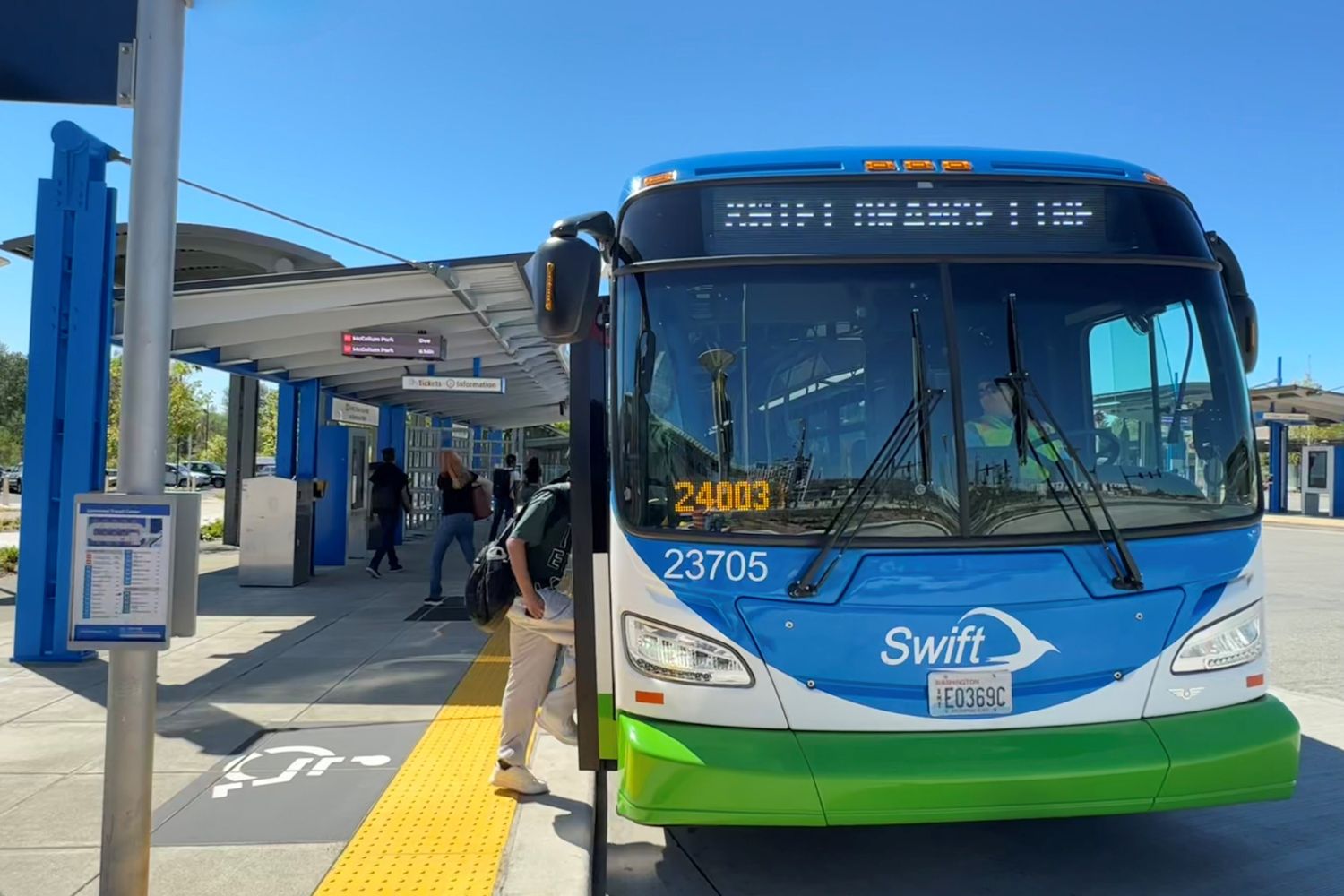 People boarding the Swift Orange Line at the Lynnwood Transit Center.