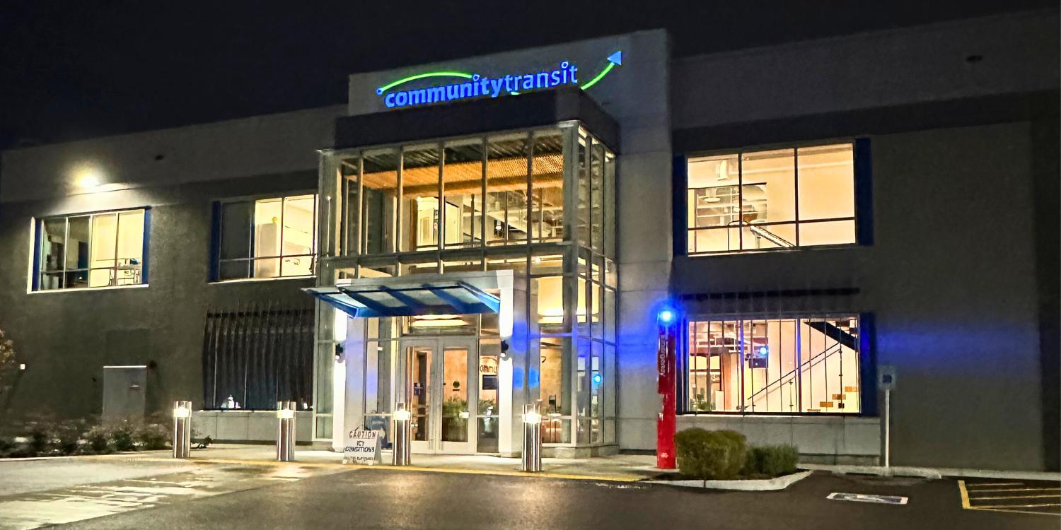 A picture of the entrance of Community Transit's Cascade Administrative Building at night