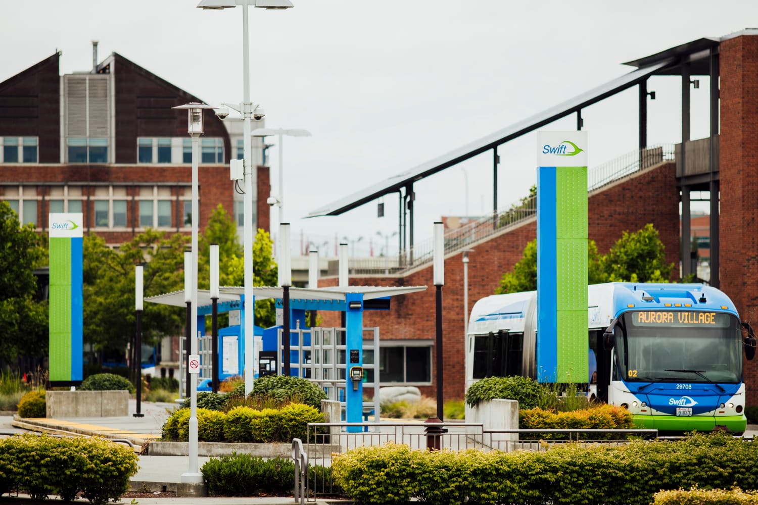 A Community Transit Swift bus arrives at a Swift Blue Line stop at Everett Station.