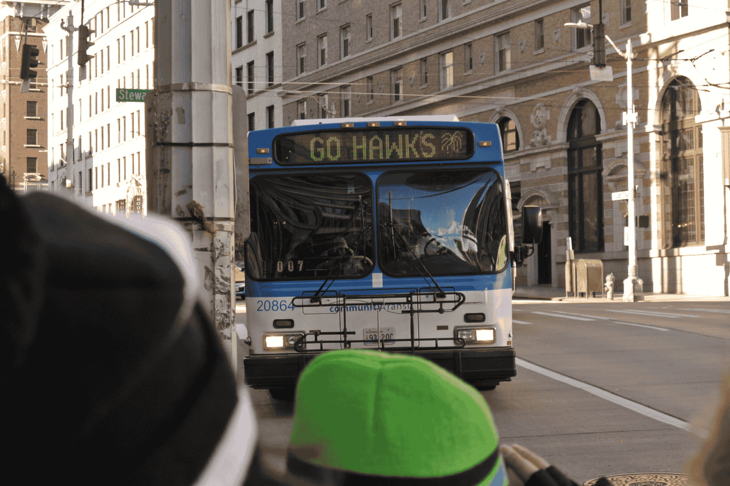 12s wait at a stop at 6th & Stewart St in downtown Seattle after the 2014 Seahawks victory parade.