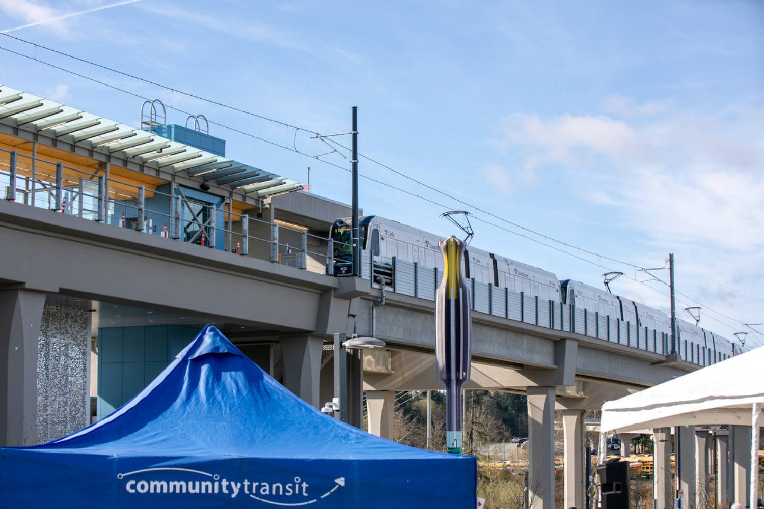 A Link 1 Line light rail train is parked at Lynnwood Transit Center during the Swift Orange Line launch ceremony on March 30,2024