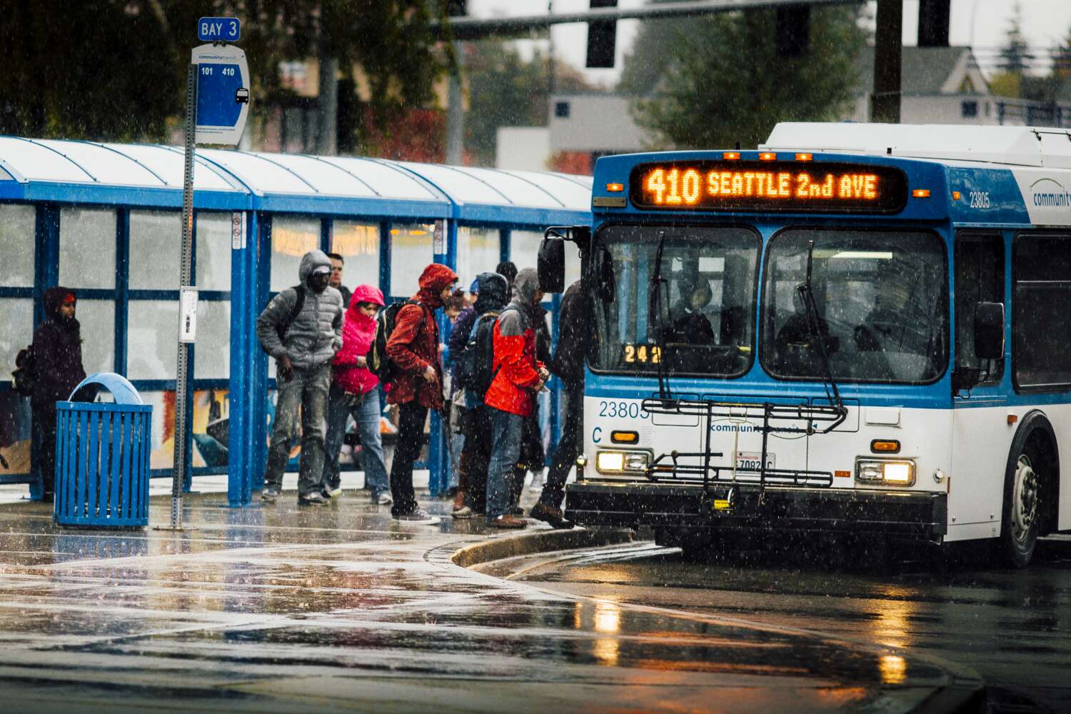 Image of Community Transit bus driving by Seattle's Pike Place Market.