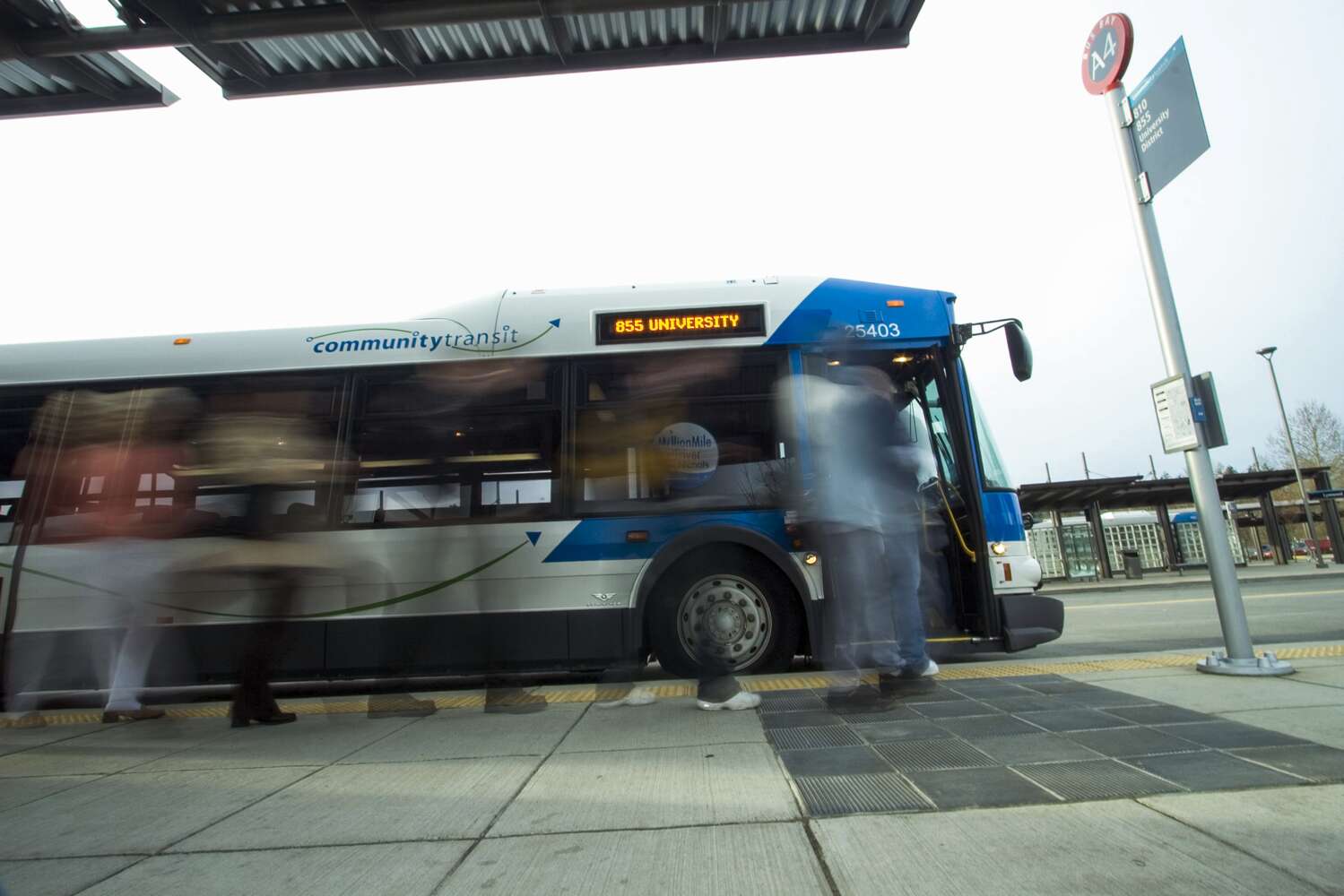 Image of Community Transit bus driving by Seattle's Pike Place Market.