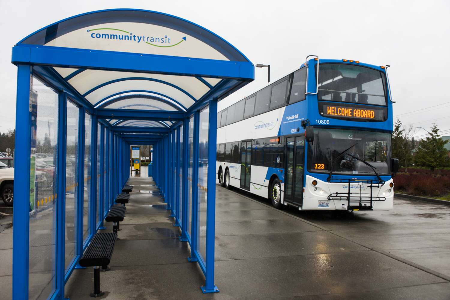 Community Transit double tall bus pulls up to bus stop