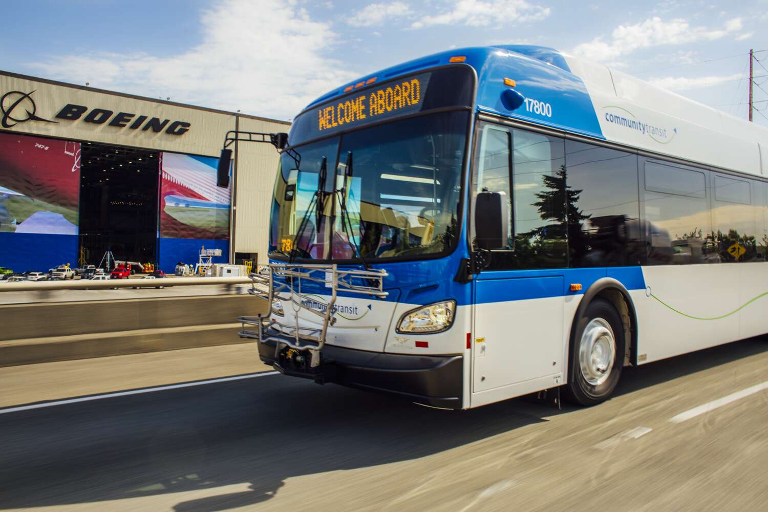 Image of Community Transit bus driving by Seattle's Pike Place Market.