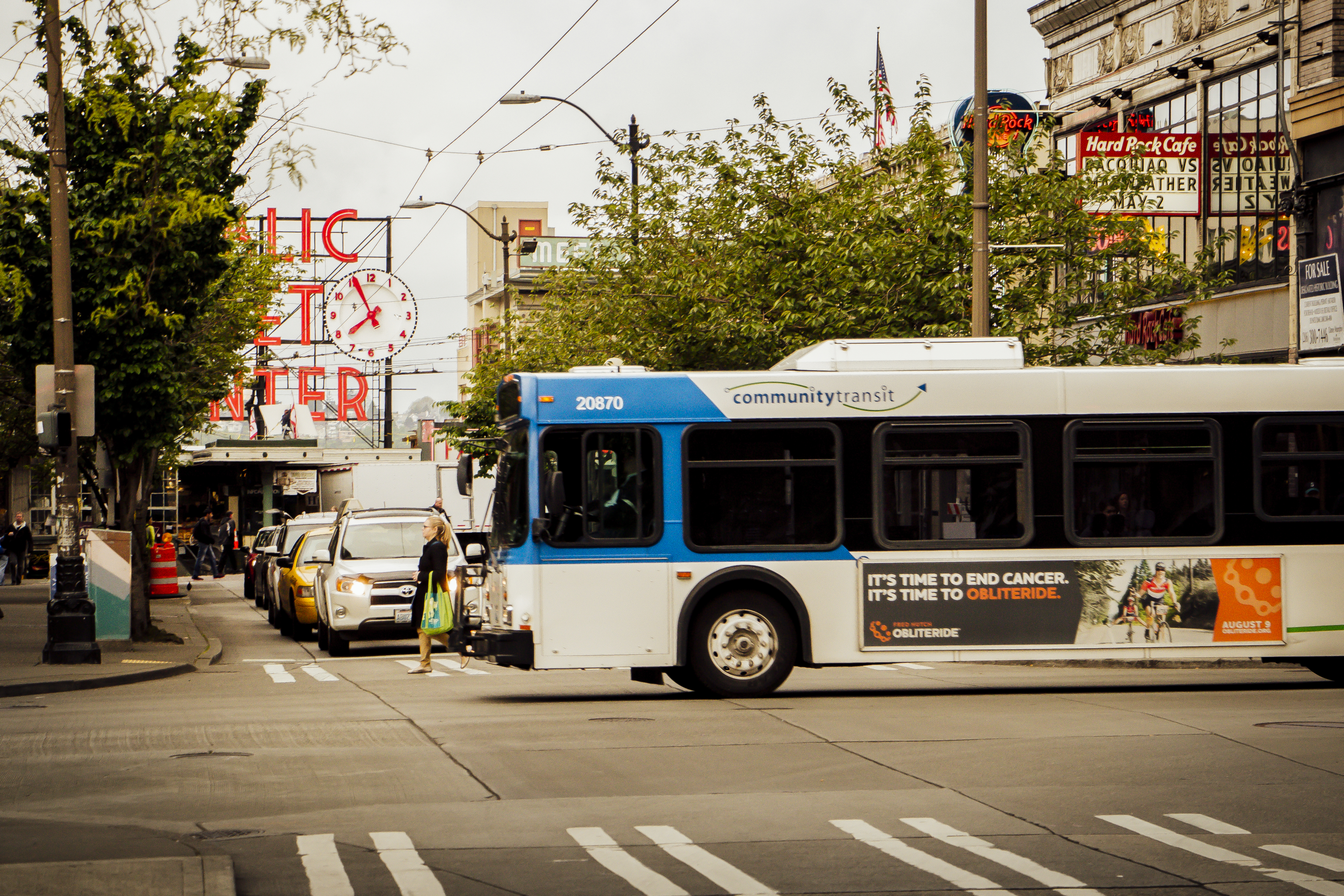 Image of Community Transit bus driving by Seattle's Pike Place Market.