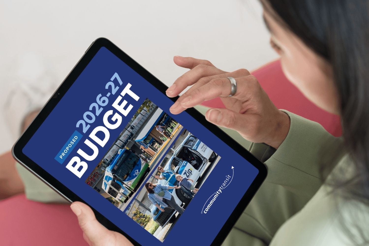 A woman with dark hair using a tablet