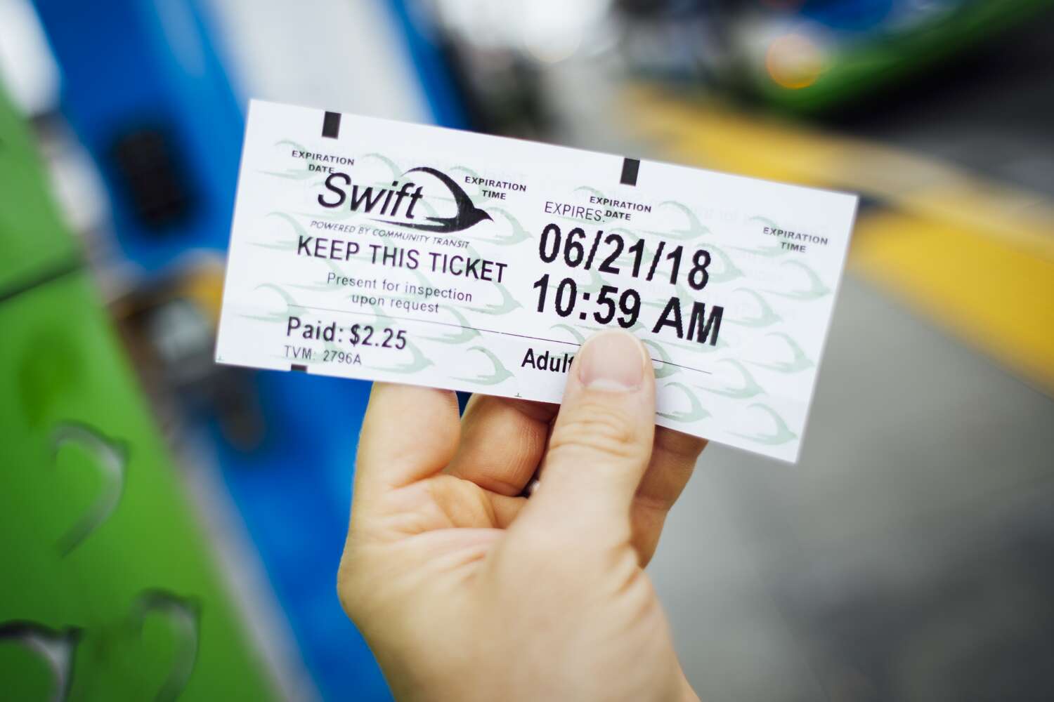Rider holding a ticket for a Swift Line bus