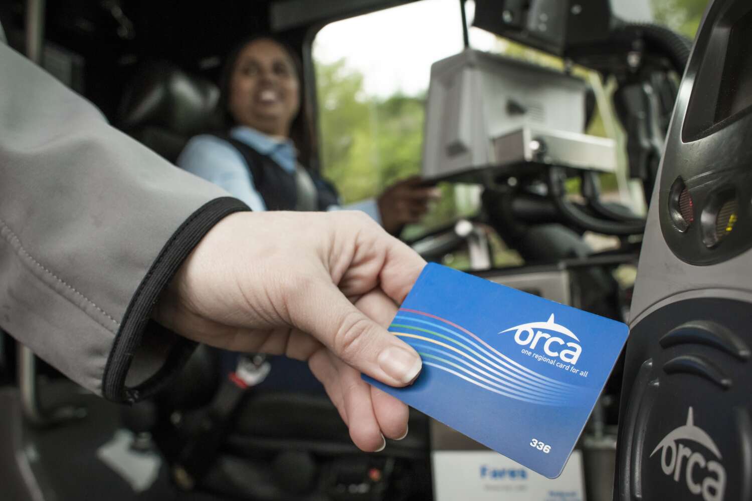 Rider uses ORCA card to board a Community Transit bus