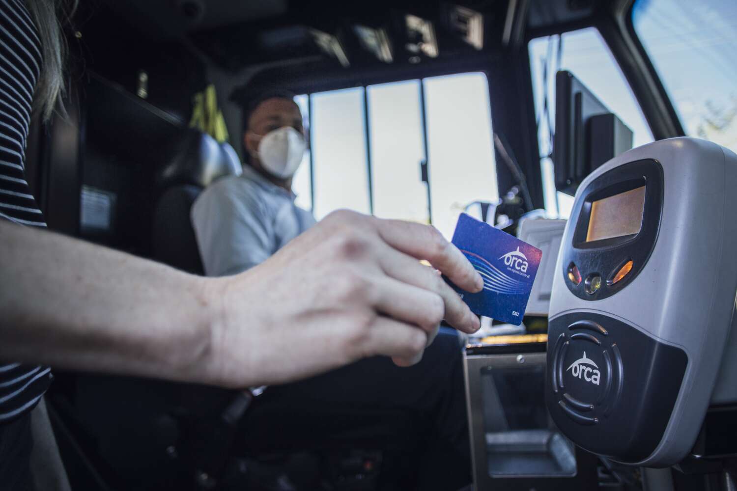 Rider uses ORCA card to ride the bus