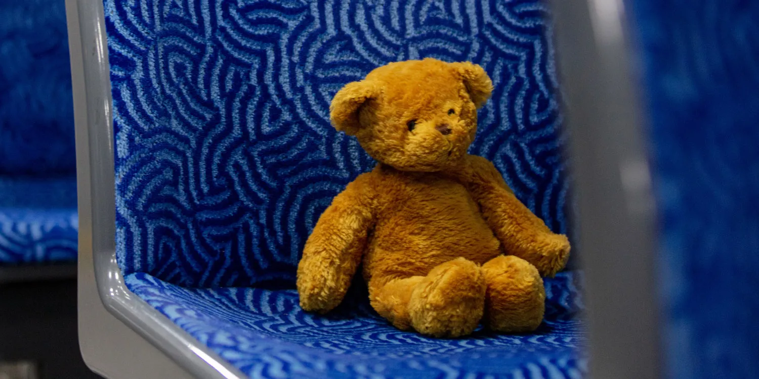 a lost teddy bear sitting on a bus seat