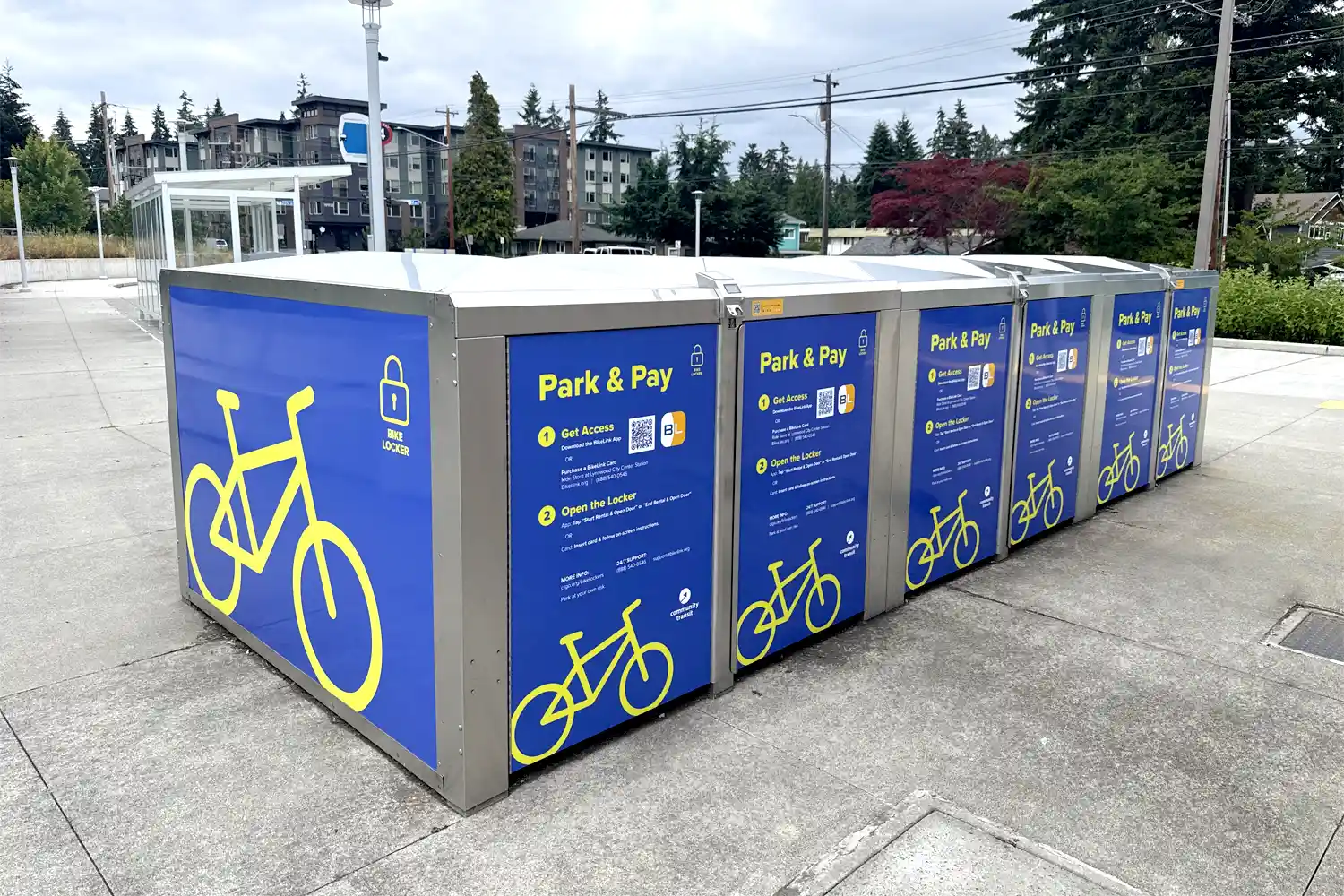 a row of bike lockers at a park and ride