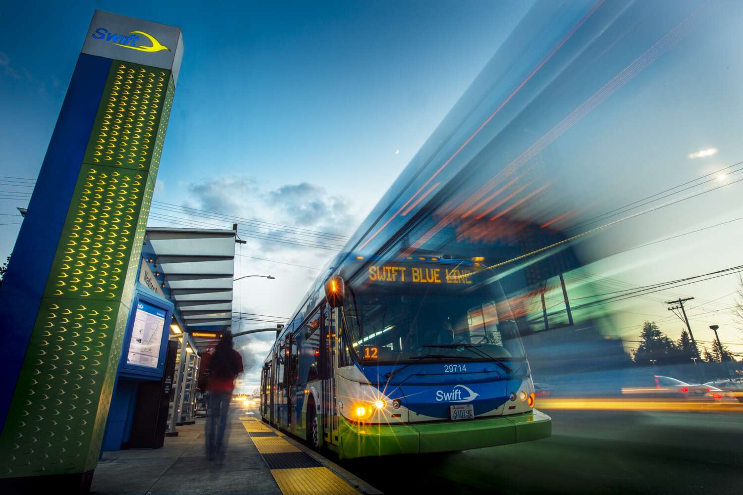 Swift Blue Line bus pulls away from a bus stop