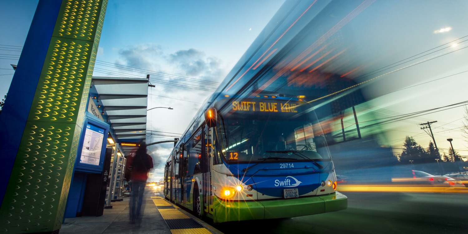 Swift bus leaving a bus stop