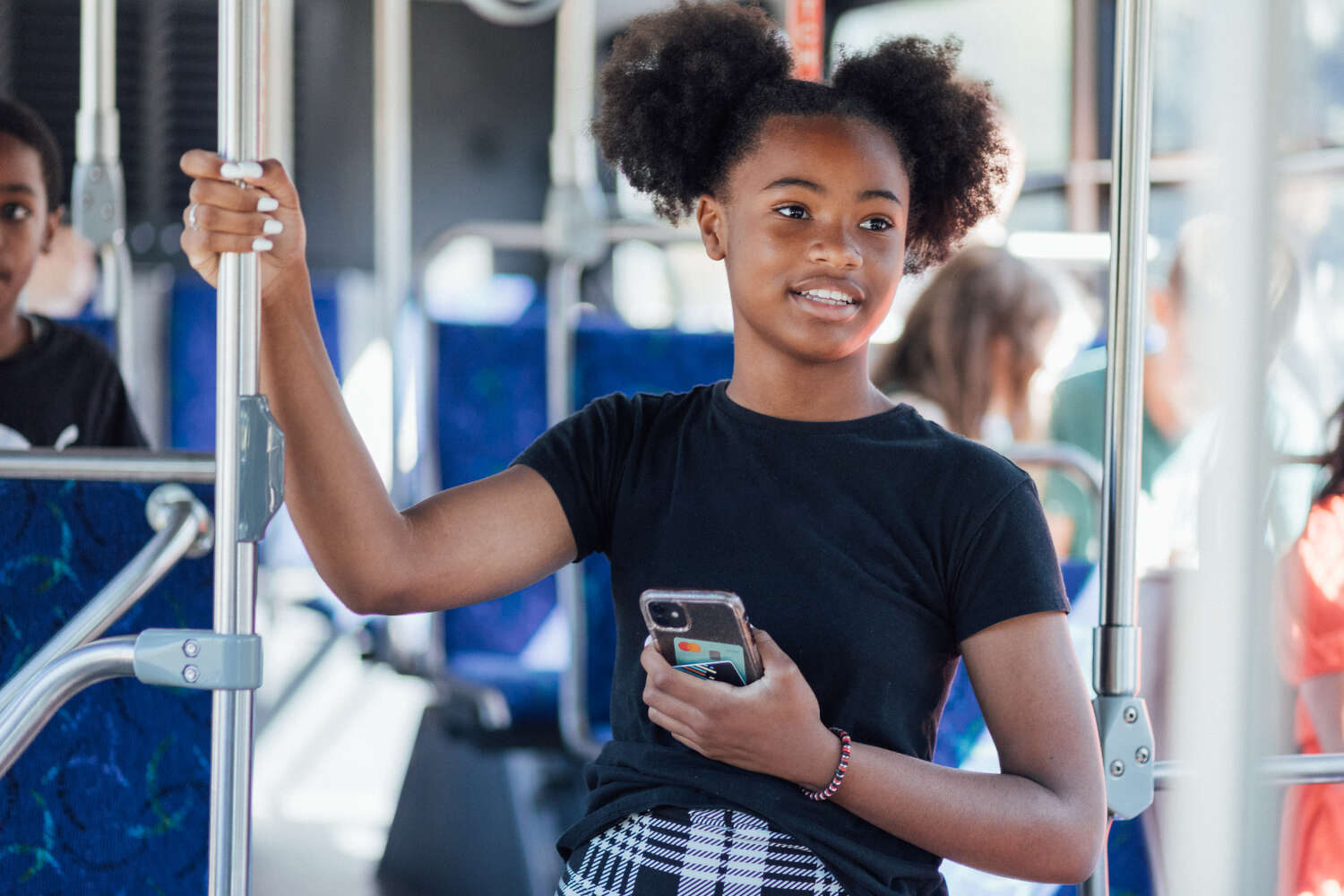 Smiling youth bus rider