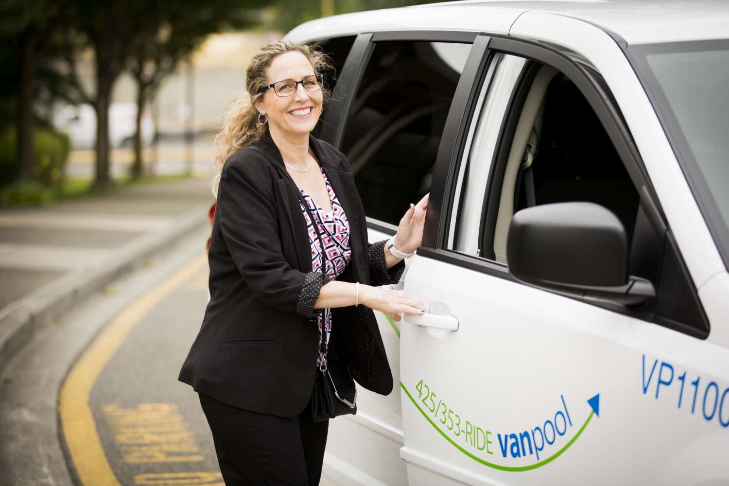 Woman enters a Community Transit vanpool van