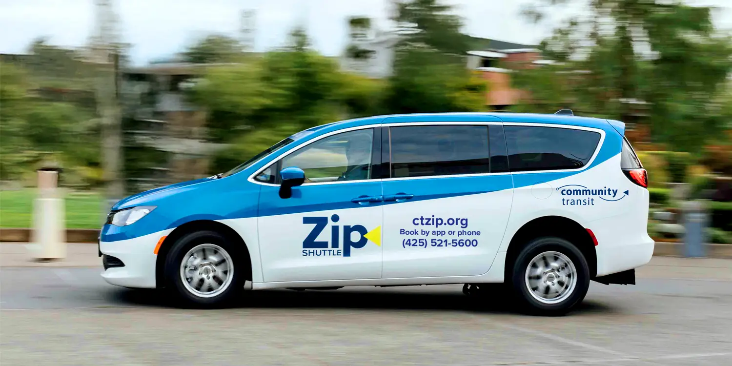 a Zip Shuttle van driving