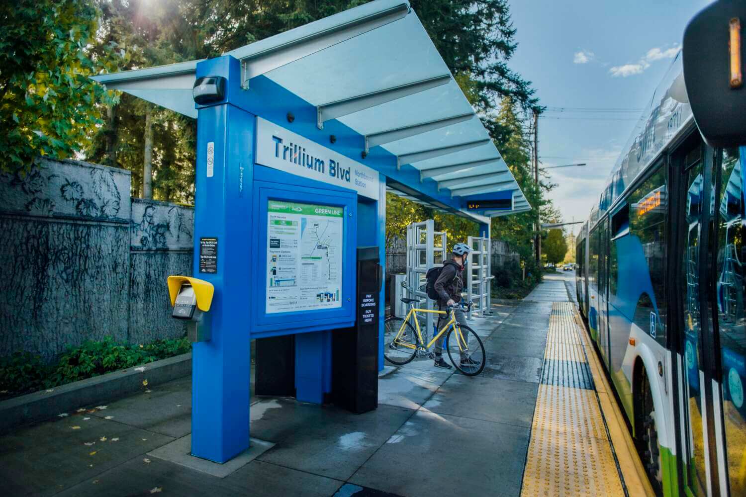 Rider with their bike at a Community Transit bus stop