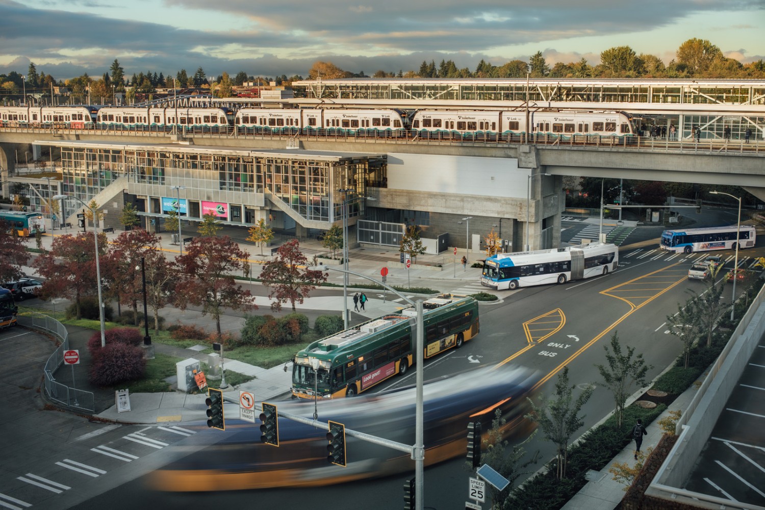 A overhead view of Northgate Station in North Seattle. Link light rail is on the track above Community Transit and Sound Transit buses on street level.